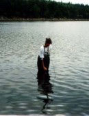 Biologist, Tara Travers, sampling at Wrights Lake