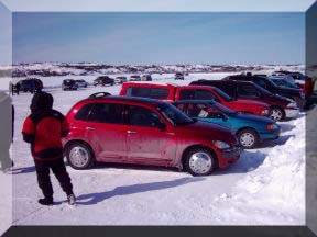 Cars by checkpoint 1 on the Dettah Ice Road, Yellowknife Bay